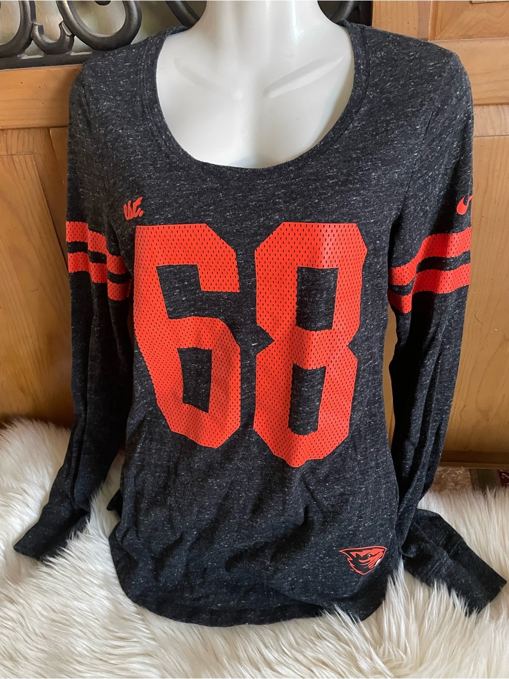 Nike Women’s Charcoal Scoop Neck Long Sleeve Tee with Bright Orange ‘68’ Graphic